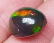 Голям черен опал с изумяваща игра на цветове тип дъга 6.59кт! Нов!, снимка 7