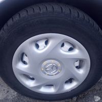 зимни гуми със железни джанти и оригинални тасове , снимка 1 - Гуми и джанти - 45572396