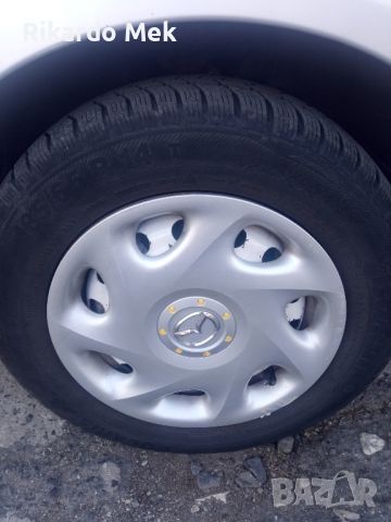 зимни гуми със железни джанти и оригинални тасове , снимка 1 - Гуми и джанти - 45572396