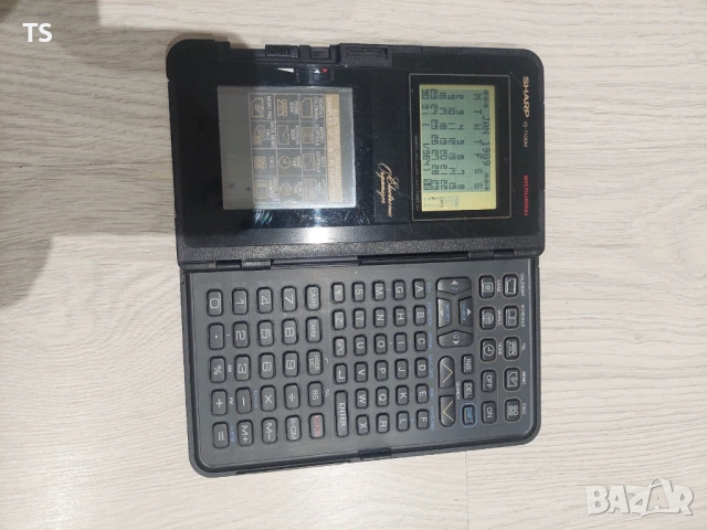 Ретро, винтидж калкулатор/органайзер Sharp IQ 7100, снимка 4 - Антикварни и старинни предмети - 53297433