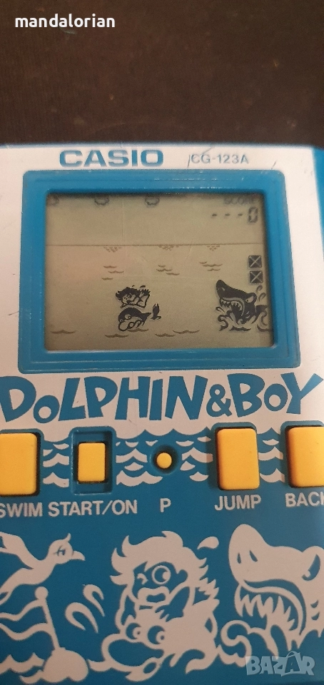 Casio CG-123A Dolphin & Boy Handheld Game 1987 Vintage , снимка 1