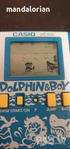 Casio CG-123A Dolphin & Boy Handheld Game 1987 Vintage 