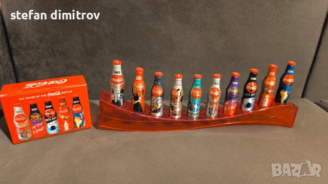 Coca Cola 100 години комплект бутилки, 10 мини алуминиеви бутилки с поставка
