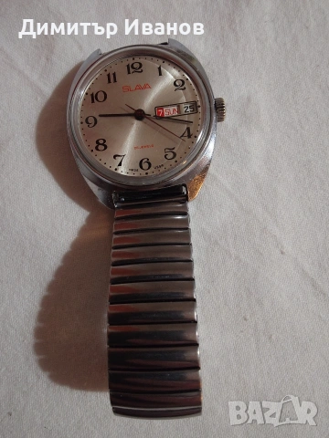 Слава -съветски механичен часовник - автоматик. В много добро състояние, сменя ден и дата. 