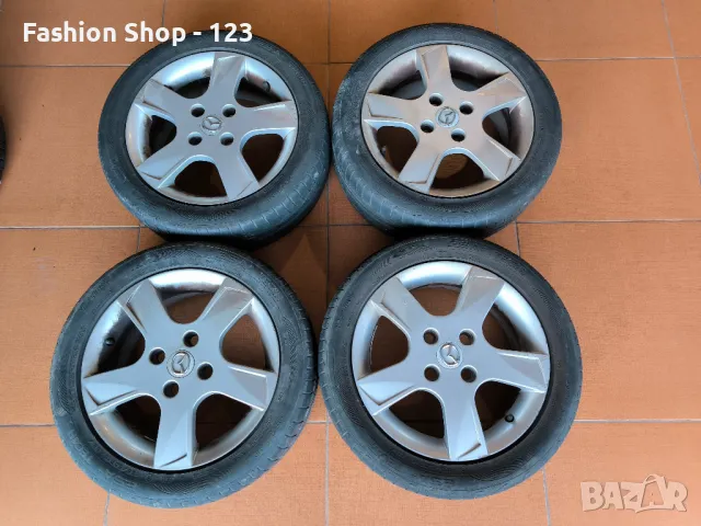 4 джанти 4x100 с гуми 195/50 r15 за Mazda, снимка 1 - Гуми и джанти - 47672709