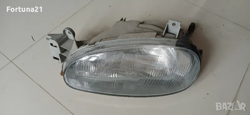 Mazda 121 - ляв фар, снимка 1