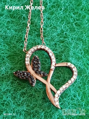 Изящно сребърно колие с медальон декорирано с черни и бели кристали 52753