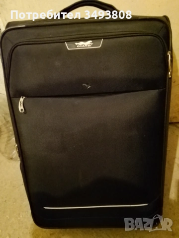 Употребяван черен туристически куфар 