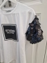 Спортно-елегантна дамска тениска - бяла с черна щампа и пайети, размер S, снимка 2