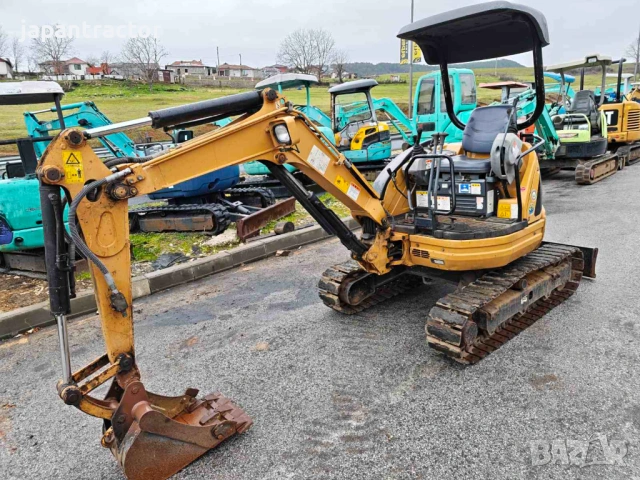 Багер Caterpillar НОВ ВНОС 2100кг