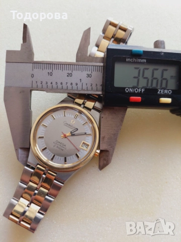 Мъжки Часовник Омега,злато стомана ,Omega Constellation-швейцарски електромеханичен часовник 1970, снимка 13 - Мъжки - 52016396