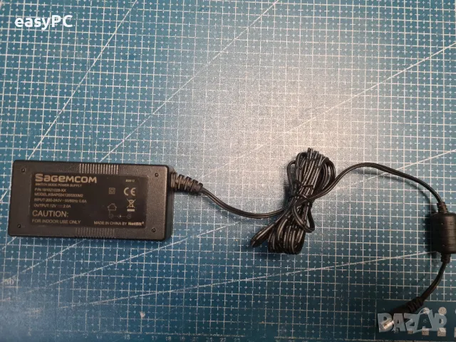 Оригинален захранващ адаптер SAGEMCOM  12V 2.0A , снимка 2 - Друга електроника - 49298897