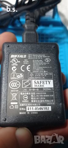 Оригинално зарядно устройство Buffalo 3.3V 2.0A 5.5mm x 2.5mm AC Зарядно устройство PSU UIA312-3320, снимка 1 - Кабели и адаптери - 45455459