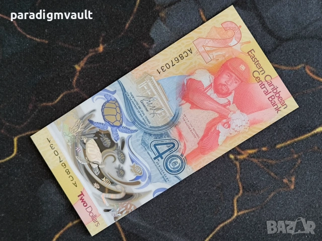 Банкнота - Източни Кариби - 2 долара (юбилейна) UNC | 2023г.
