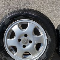 Зимни гуми с алуминиеви джанти 185/65/14, снимка 1 - Гуми и джанти - 45491971