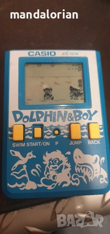 Casio CG-123A Dolphin & Boy Handheld Game 1987 Vintage , снимка 2 - Други игри и конзоли - 52641437