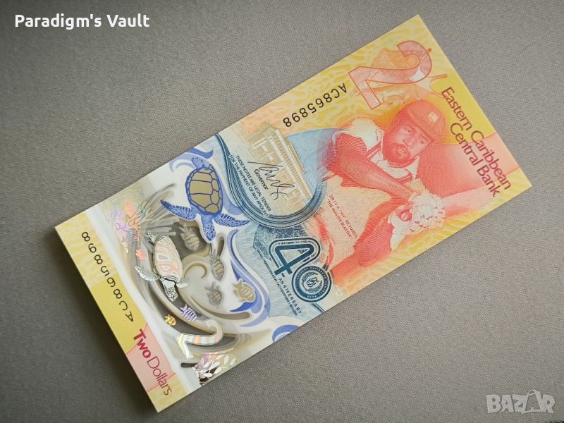 Банкнота - Източни Кариби - 2 долара (юбилейна) UNC | 2023г., снимка 1