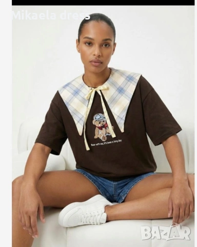 Тениска с мече в многоцветни тонове. Идеална за всекидневието и лесна за комбиниране.