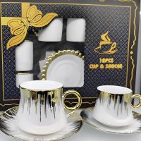 Порцеланов комплект,златен с бяло,6 чаши,6 чинийки, снимка 1 - Сервизи - 46139434