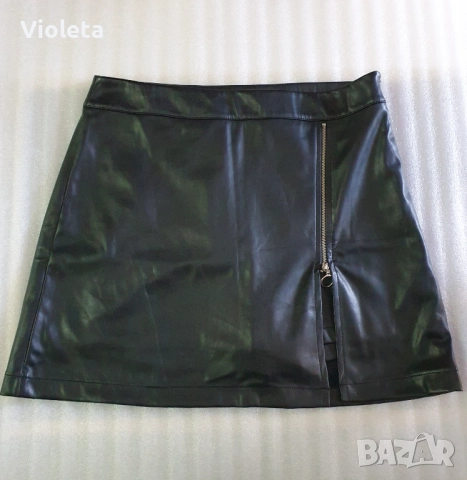 Къса пола от еко кожа с панталонки. Обиколка на талията 82см.