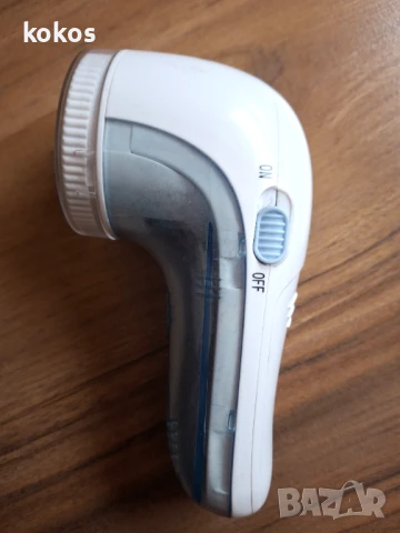 Уред за премахване на влакна, мъх и топчета от дрехи