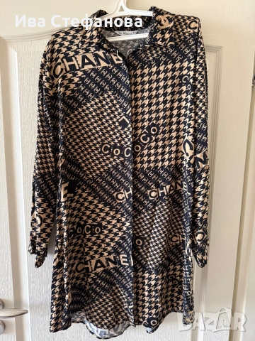 Нова елегантна разкошна туника риза Chanel , брандирана навсякъде с логото на марката .