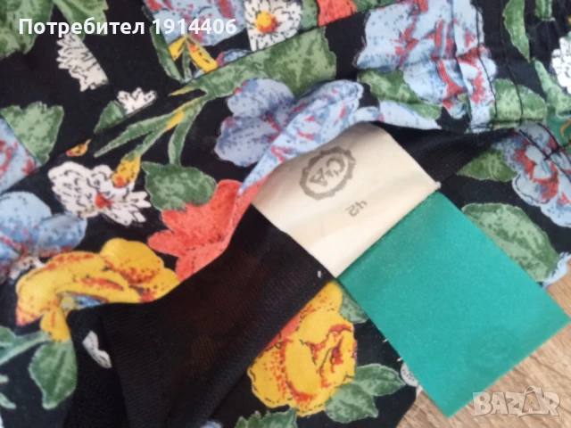 Елегантна дамска пола на цветя, ефирна и лека материя, Марка Canda размер 42, снимка 7 - Поли - 50585176