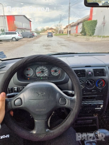 Daihatsu Sirion, снимка 15 - Автомобили и джипове - 54244160