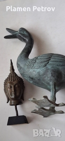 Стара бронзова патица и Буда