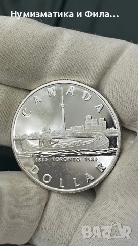 Сребърна монета Канада 1 долар 1984 година, снимка 2 - Нумизматика и бонистика - 52705455