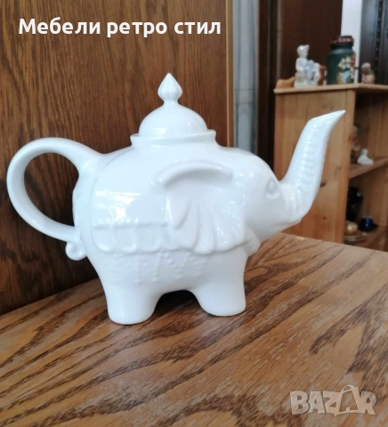 Чайник от бял порцелан, изработен във формата на щастливо слонче с вдигнат хобот и релефни детайли. , снимка 3 - Декорация за дома - 52007567
