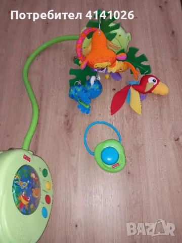 Музикалната въртележка на Fisher Price Rainforest Peek a Boo Leaves, снимка 1 - Музикални играчки - 46998770