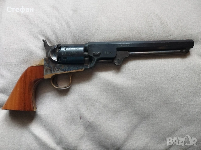 Револвер Колт.