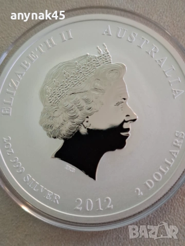 Сребро 2 oz.2012 Лунар годината на Дракона, снимка 4 - Нумизматика и бонистика - 53816877