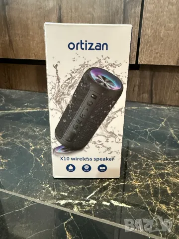 Преносим Bluetooth високоговорител Ortizan с ритмични светлини, снимка 3 - Тонколони - 49868200