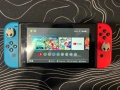 Nintendo switch с 2 игри и две SD карти + подарък , снимка 1