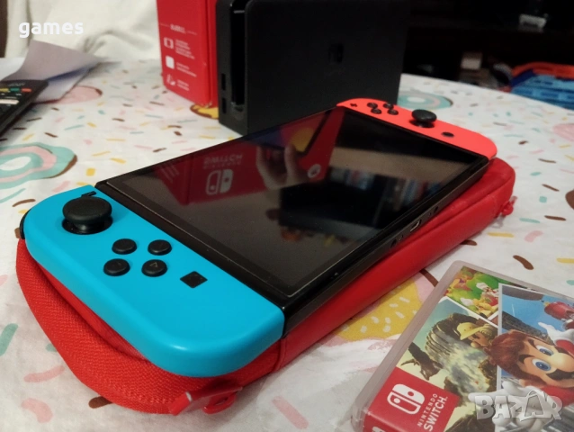 Nintendo Switch OLED със Super Mario Odyssey и калъф, снимка 3 - Nintendo конзоли - 53818065