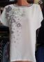Бяла блуза с принт цветя и лилав кант около деколтето, снимка 1 - Тениски - 45565948