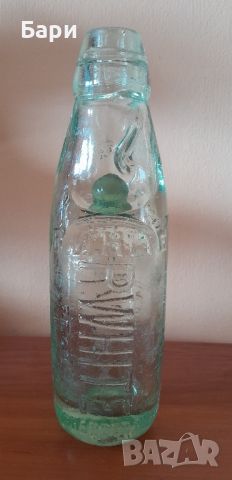 Старо стъклено шише с топче