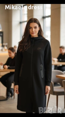 Дълго спортно горнище на Nke в черен цвят, с чист и елегантен дизайн. Подходящо за спорт и ежедневие