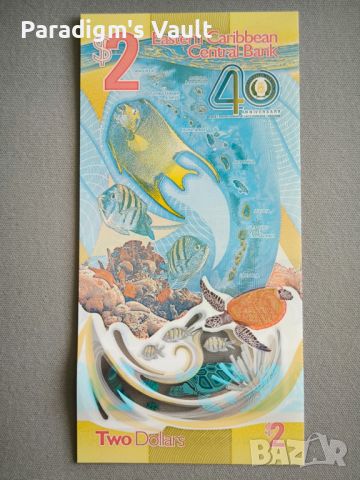Банкнота - Източни Кариби - 2 долара (юбилейна) UNC | 2023г., снимка 5 - Нумизматика и бонистика - 45694063