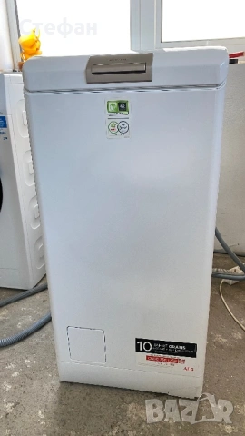 Пералня с горно отваряне AEG