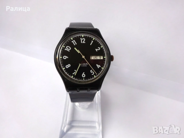 Кварцов часовник  Swatch с ден и дата