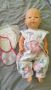 Baby Amore Pipi Popo време е за смяна на пелени с 2 дрешки, снимка 1 - Кукли - 45433471