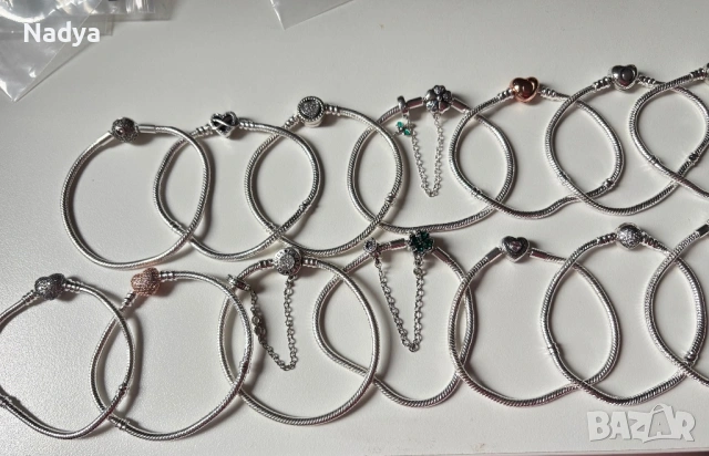 Гривни и талисмани Pandora