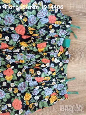 Елегантна дамска пола на цветя, ефирна и лека материя, Марка Canda размер 42, снимка 4 - Поли - 50585176