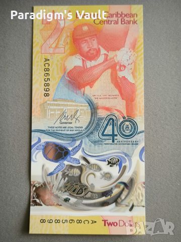 Банкнота - Източни Кариби - 2 долара (юбилейна) UNC | 2023г., снимка 2 - Нумизматика и бонистика - 45694063