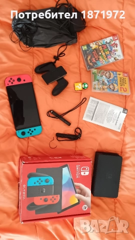 Продавам Nintendo Switch OLED ,пълен комплект + 2 оригинални игри