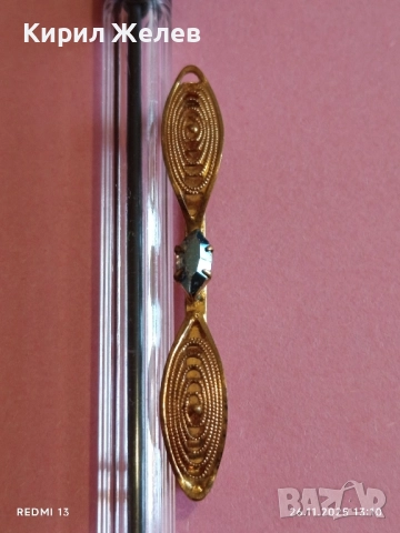 Златиста брошка с овални елементи и син камък ТОПАЗ 52187