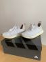 Adidas NMD R1 STLT Primeknit Cloud White Sneakers.